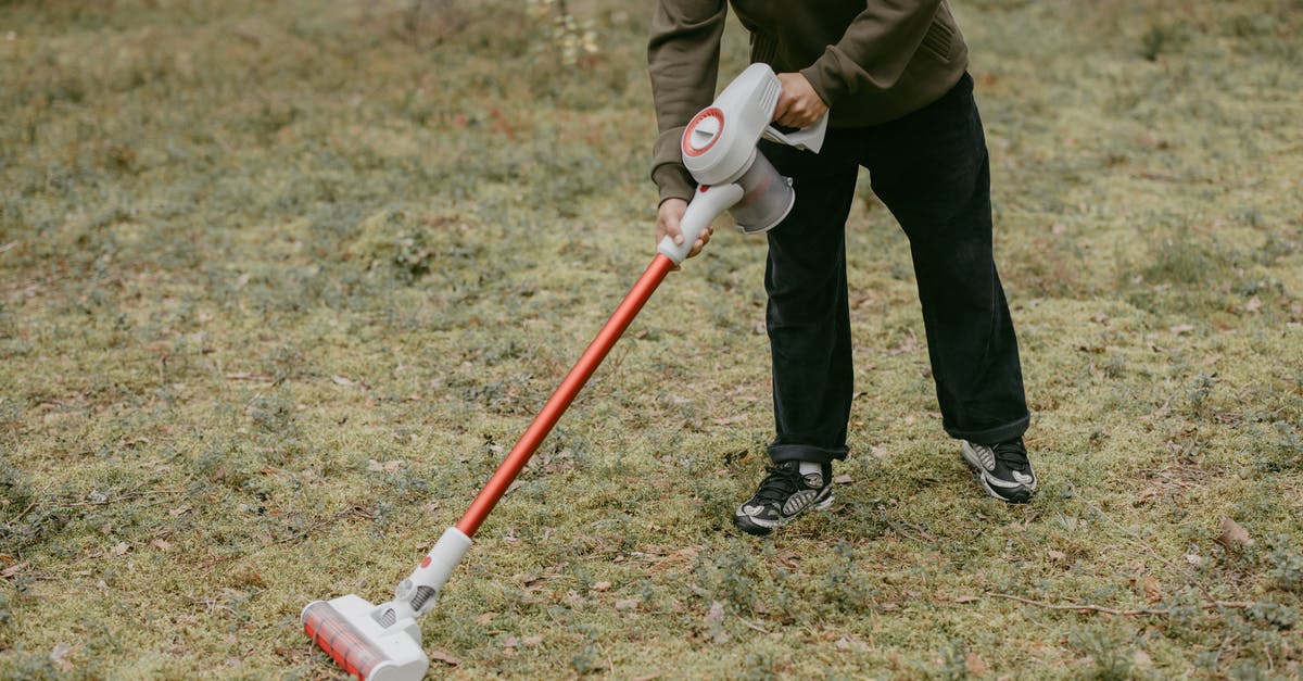 better to marinate in vacuum? - Man in Brown Jacket and Black Pants Holding Red and White Stick