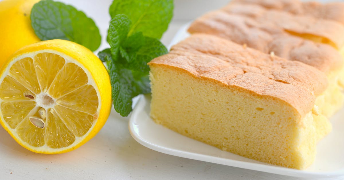 Biga Bread sponge - Close-Up View of Sliced Sponge Cake on a Plate beside a Lemon