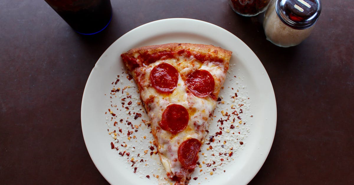 Binder, thickener, emulsifier for parmesan? - Sliced Pepperoni Pizza on White Ceramic Plate