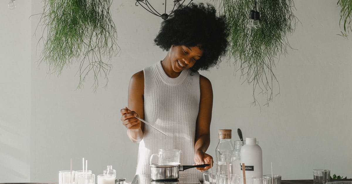 Bircher muesli: how to make oats soak liquid - Smiling woman making candles in workshop