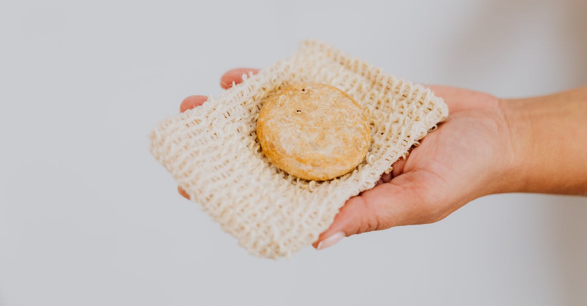 Biscuit burning around sides [closed] - Person Holding White and Yellow Knit Textile