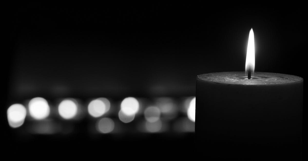 Biscuit burning around sides [closed] - White Pillar Candle in Black Background