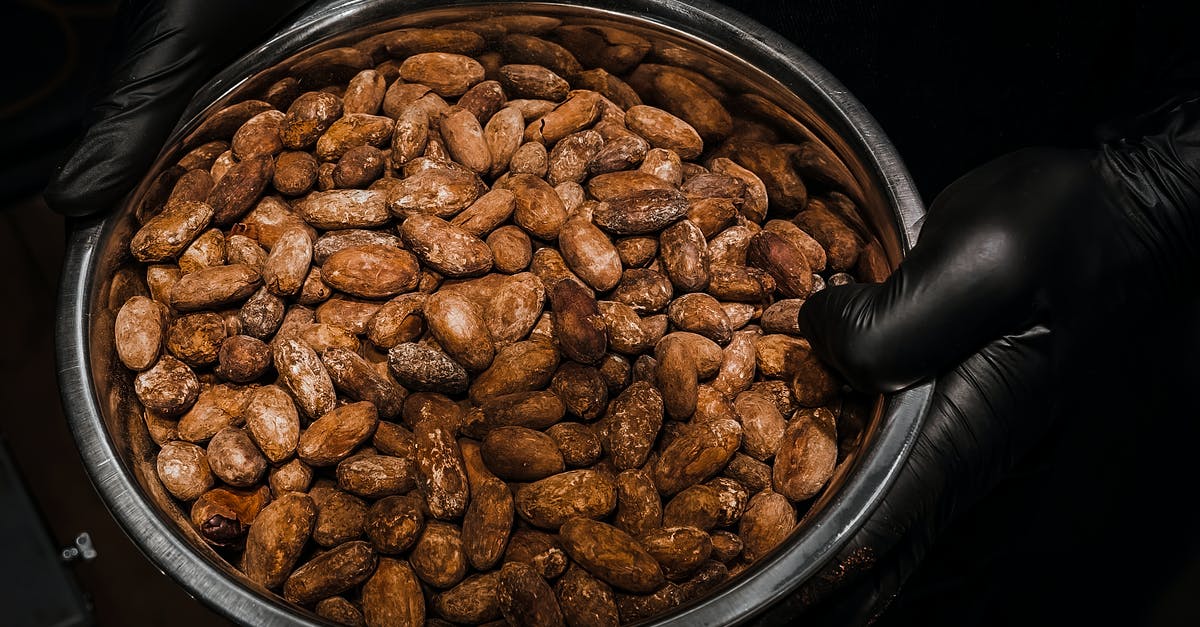 Bitter roasted beets - Brown Cocoa Beans on Stainless Steel Bowl