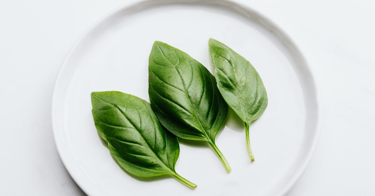 Bitter taste of rocket pesto - Green Leaves on White Ceramic Plate