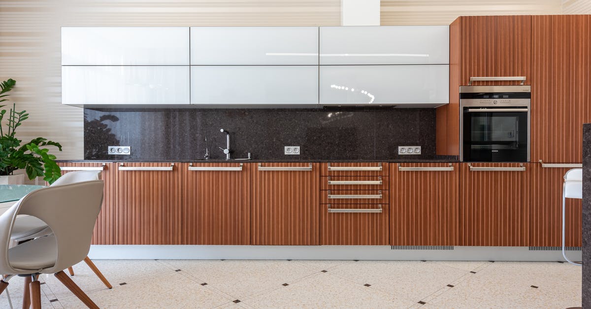 Black spots in the kitchen sink - Interior of contemporary kitchen in flat