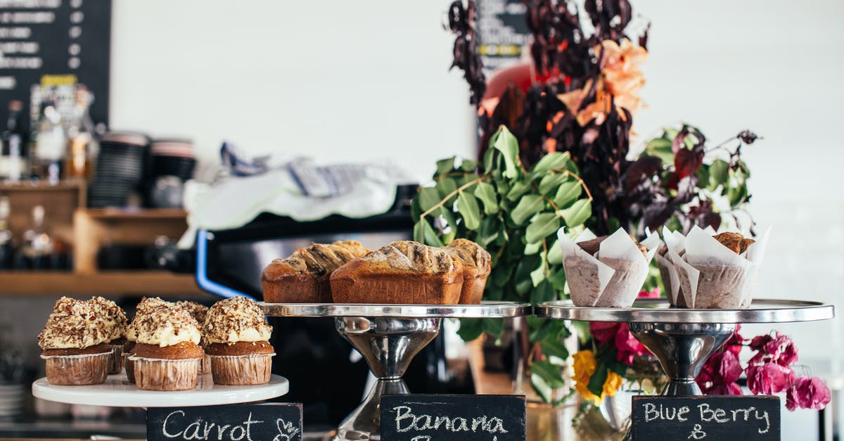 blackened carrot cake - Various many sweet cakes placed on wooden counter for sale in cafe in daytime