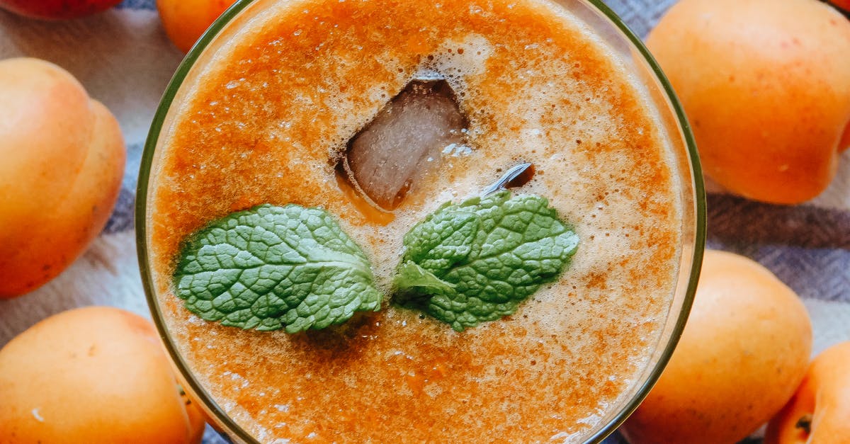 Blending a smoothie without changing the taste - Glass of fresh cocktail with apricots