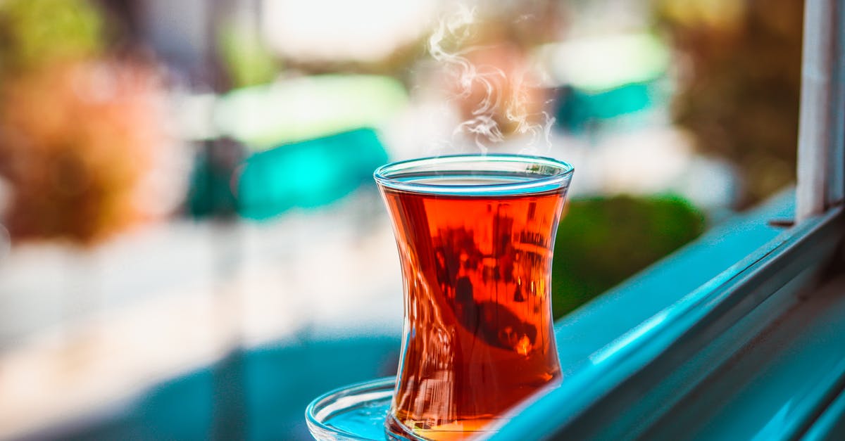 Blue floaters in canned hot peppers - Selective Focus of Turkish Teacup Filled With Tea