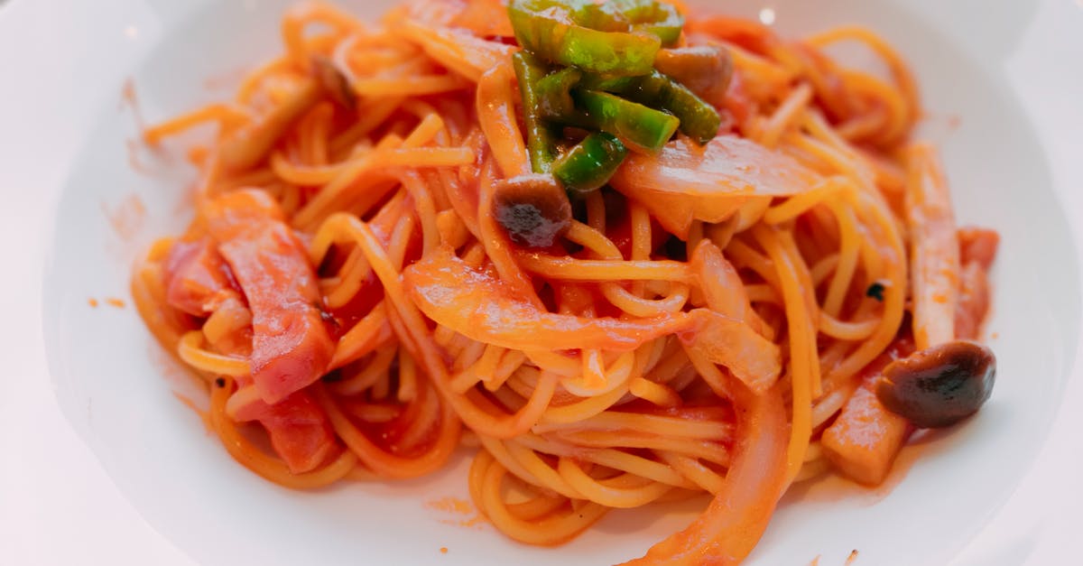 Boeuf a la ficelle - cooked in bouillon? - Spaghetti With Green Leaf on White Ceramic Plate