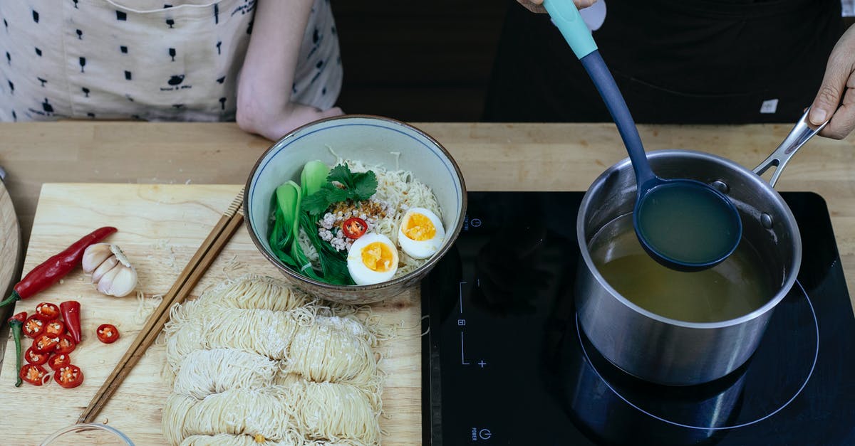 Boil an egg in the microwave - Crop faceless women adding vegetable broth to noodles