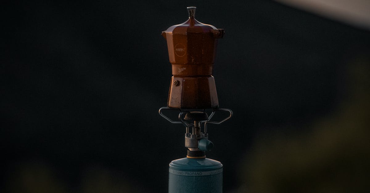 Boiled water left in a Teflon pot - Brass-colored Pot On A Gas Burner