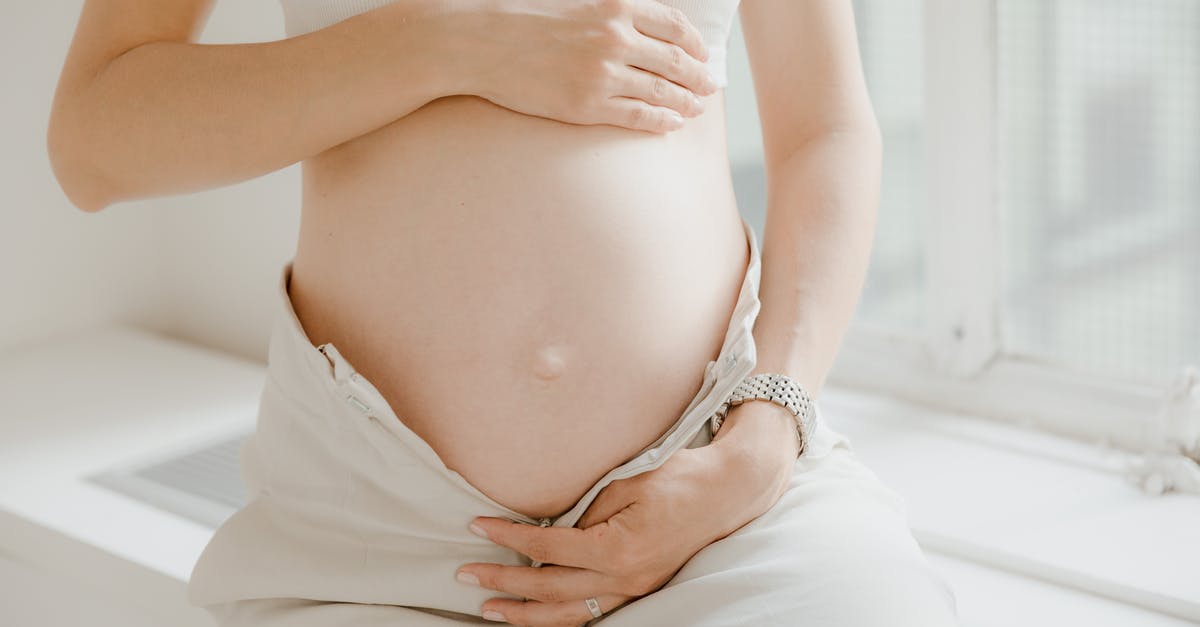 Boiling potatoes with vs. without skin - A Pregnant Woman in White Top and White Pants