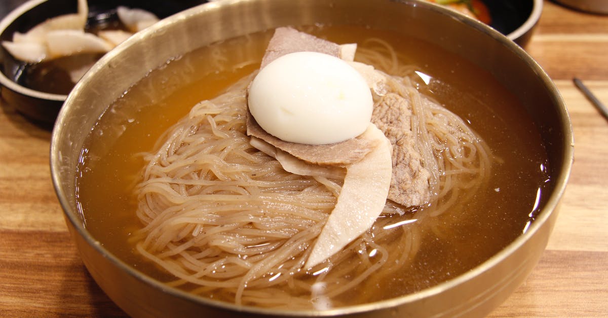 Boiling vs soaking rice noodles - Noodle Soup With Egg on Brown Wooden Bowl