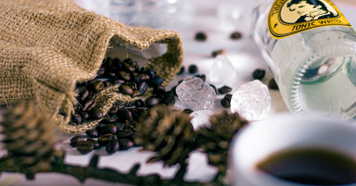 Bottling and Storing Cold-Brewed Coffee? - Selective Focus Photography of Bag of Beans Beside Clear Glass Bottle