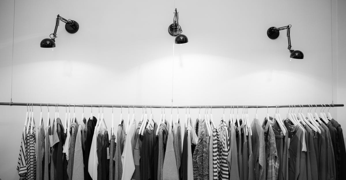 Bottling for sale [closed] - Grayscale Photography of Assorted Shirts Hanged on Clothes Rack