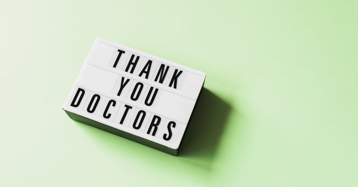 Botulism risk from anchovies in the refrigerator? - From above of vintage light box with THANK YOU DOCTORS inscription placed on green surface