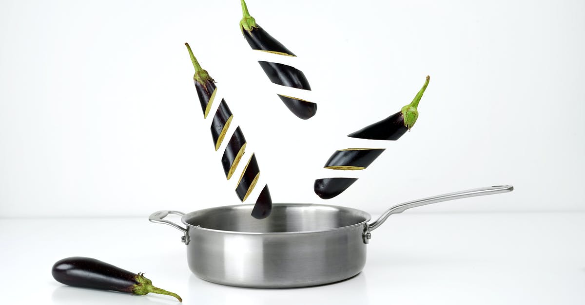 Bowed bottom on Stainless Steel fry pan - Three Sliced Eggplants and Gray Stainless Steel Non-stick Pan