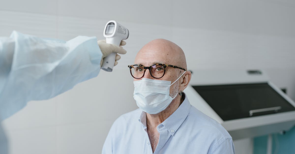 Braising brisket internal temperature - Man in White Dress Shirt Wearing White Face Mask