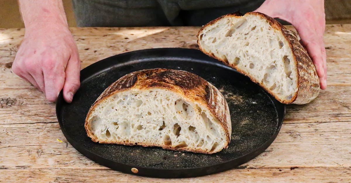 Bread crust separated from interior - Baker with cut loaf on plate