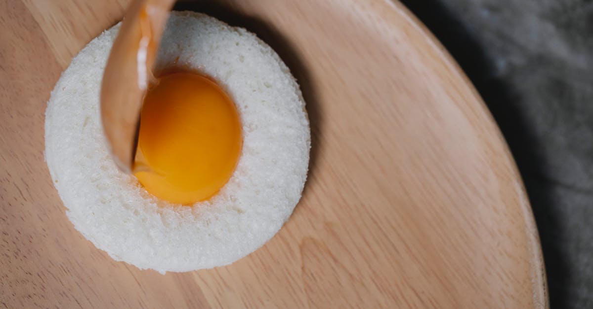 Bread: Higher rise/coarser crumb [duplicate] - Process of putting egg yolk in round bread crumb