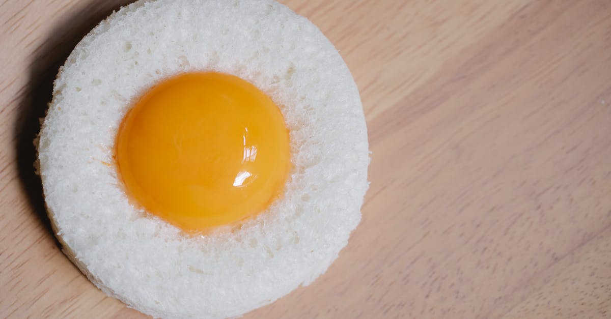 Bread: Higher rise/coarser crumb [duplicate] - Egg yolk placed in round white bread crumb