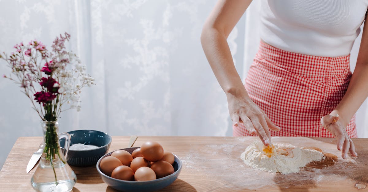 breading/crumbing: mixing the eggs and flour? - Unrecognizable Woman Mixing Ingredients for Italian Pasta on Tabletop