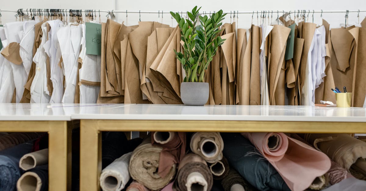 Brining rack of lamb - Rolls of assorted fabrics and textiles and sewing patterns inside tailor atelier