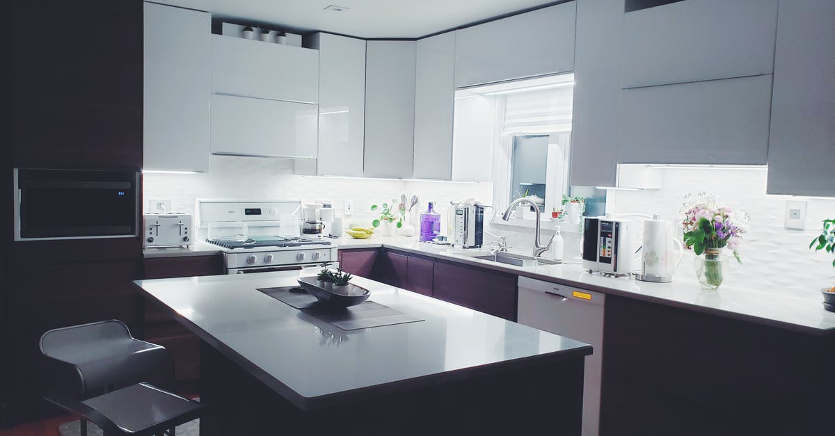 Broiler Drawer vs Oven Broiler? - Rectangular White Island Table in Kitchen