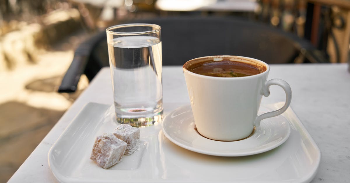 Brown rice aricini but always end up with too much water - White Ceramic Coffee Mug and Drinking Glass on Tray