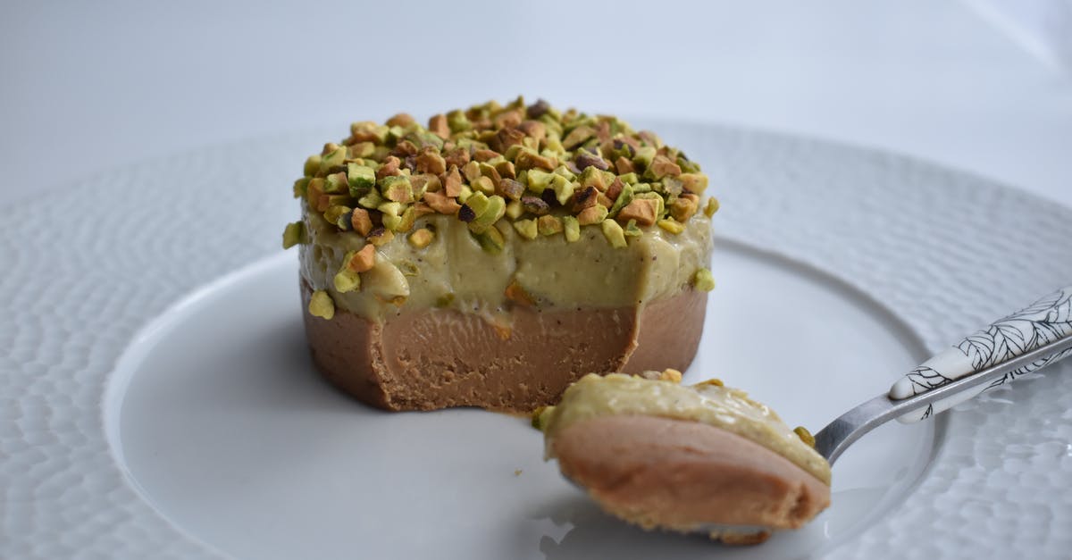 Brownie with chocolate mousse on top - Delicious dessert with pistachio topping