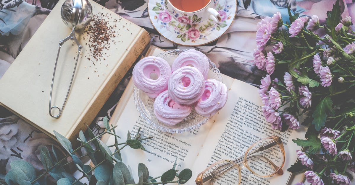 Bubble Tea - Instant or Traditional Pearls - Floral Ceramic Cup and Saucer Above Open Book