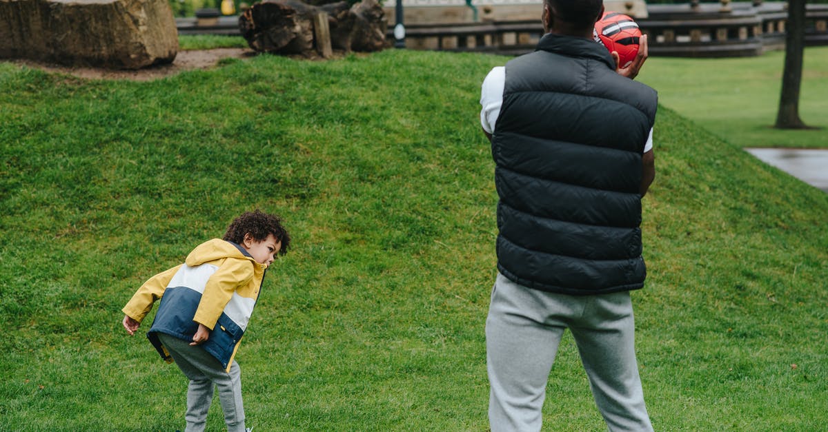 Buckwheat groats have grassy smell? - Unrecognizable black father playing with kid