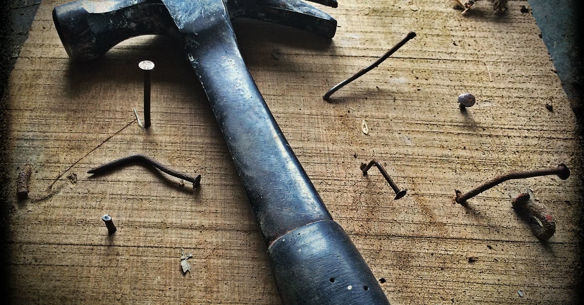 Bumps on carbon steel seasoning, can I repair it - Black Claw Hammer on Brown Wooden Plank