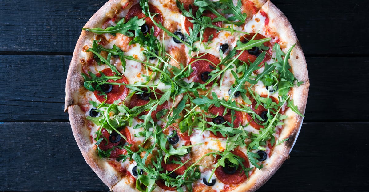 Burger/Kraft Slice Style Cheese - Tasty pizza with arugula leaves on dark background