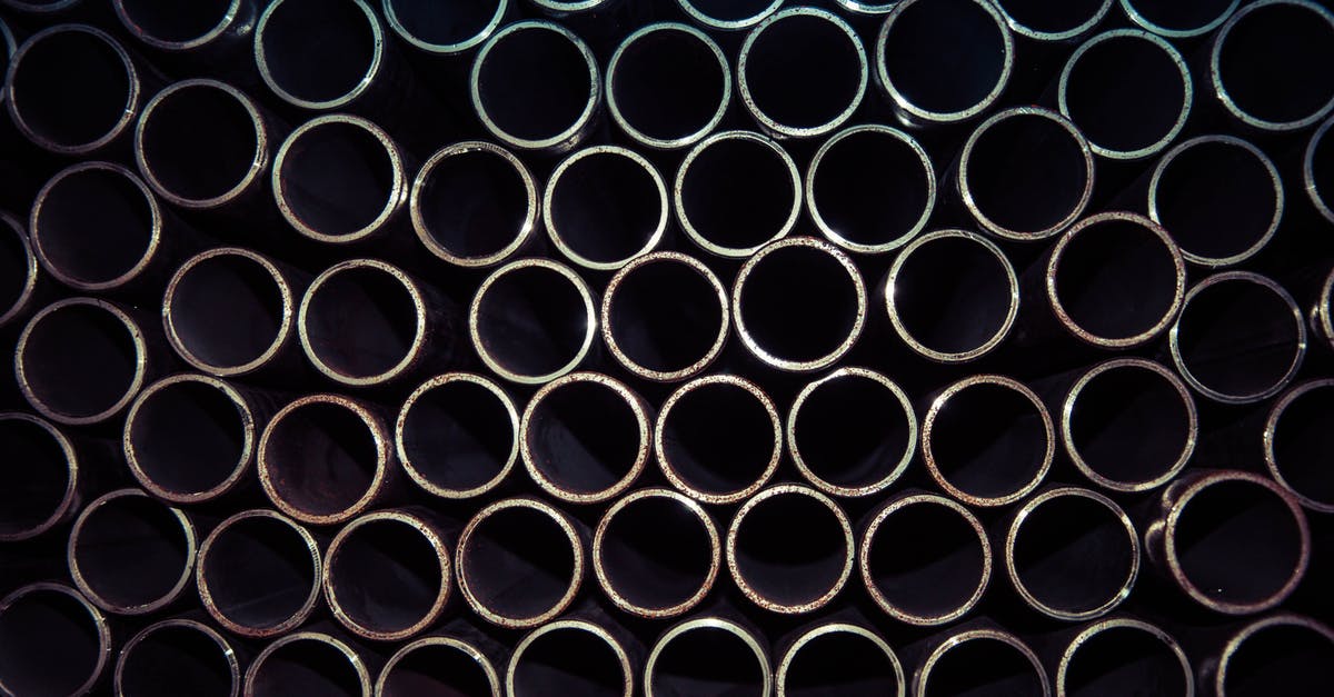 Burned enameled cast iron stock pot - Close Up Photo of Gray Metal Pipes