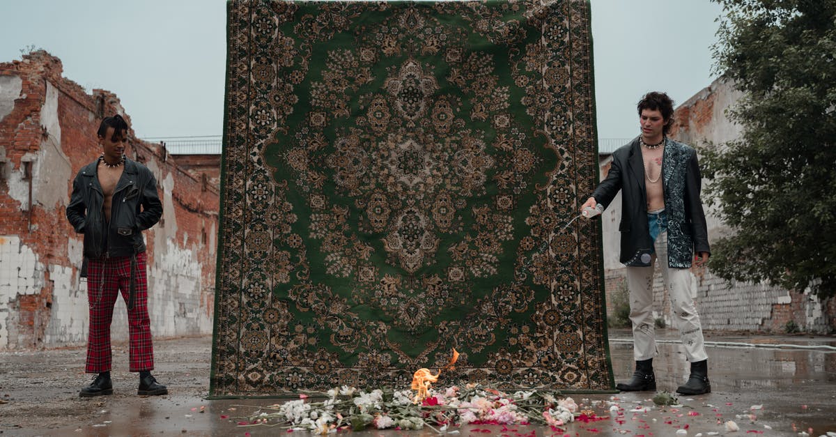 Burning crumpet bottoms - Man in Black Suit Standing Beside Woman in Black and Brown Floral Dress