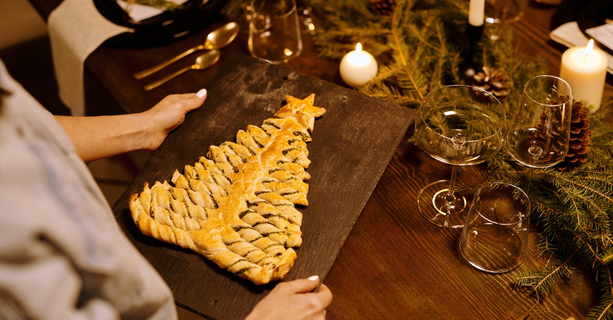 Butterscotch Pie setting - Person Serving a Freshly Baked Bread on a Wooden Tray