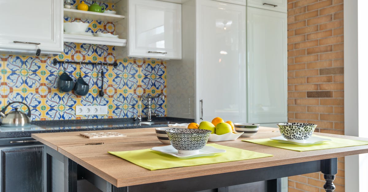 Cabinets at the top of the wall, what goes there? [closed] - Printed Bowls on a Wooden Table Top