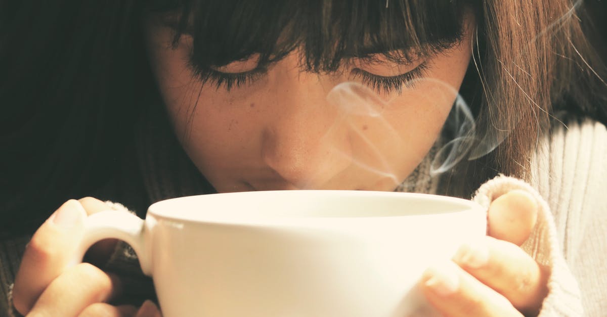 Caffeine pills don't dissolve in hot tea - Woman Holding White Cup