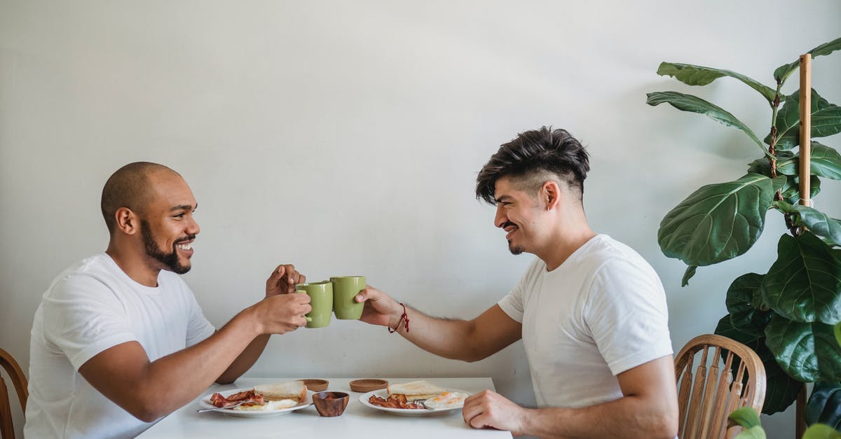 Caffettiera (Moka Pot) is not making coffee properly - Men Making Cheers with Coffee Mugs