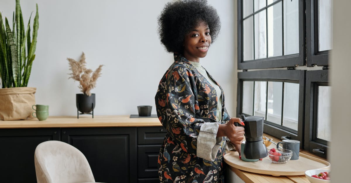 Caffettiera (Moka Pot) is not making coffee properly - Happy Woman Having Breakfast