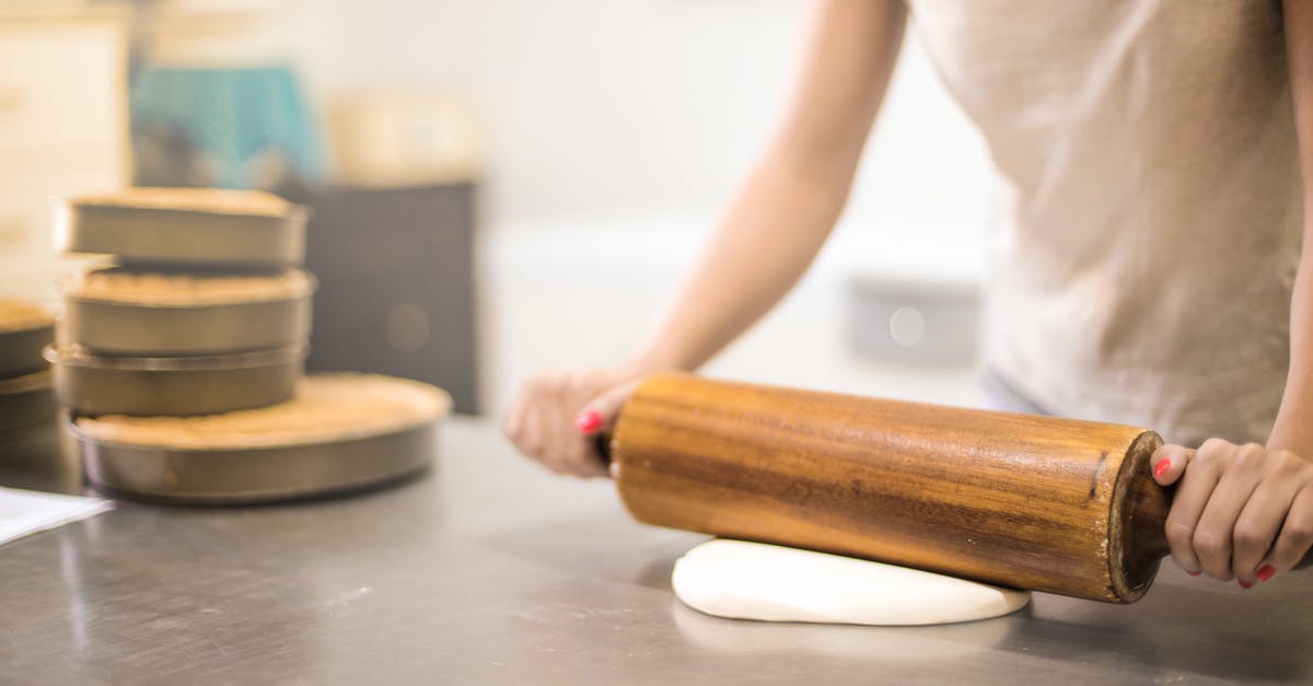 Cake flour or all-purpose for shortbread? - Person in White T-shirt Rolling a Pin in Dough