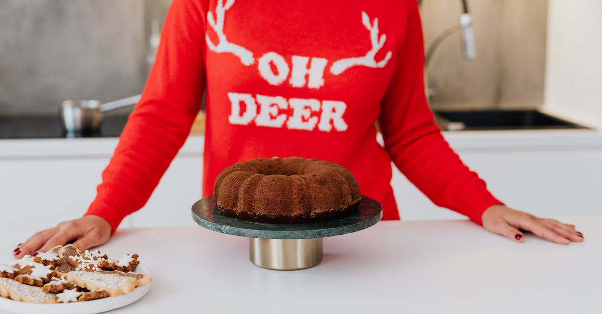 cake undercooked or too wet? - Woman in Red and White Long Sleeve Shirt Standing in Front of Chocolate Cake