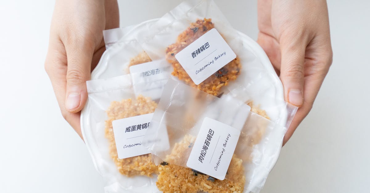 Calculating Nutrition Information for Commercial Food Labeling - Crop person holding plate with cookies in plastic bags