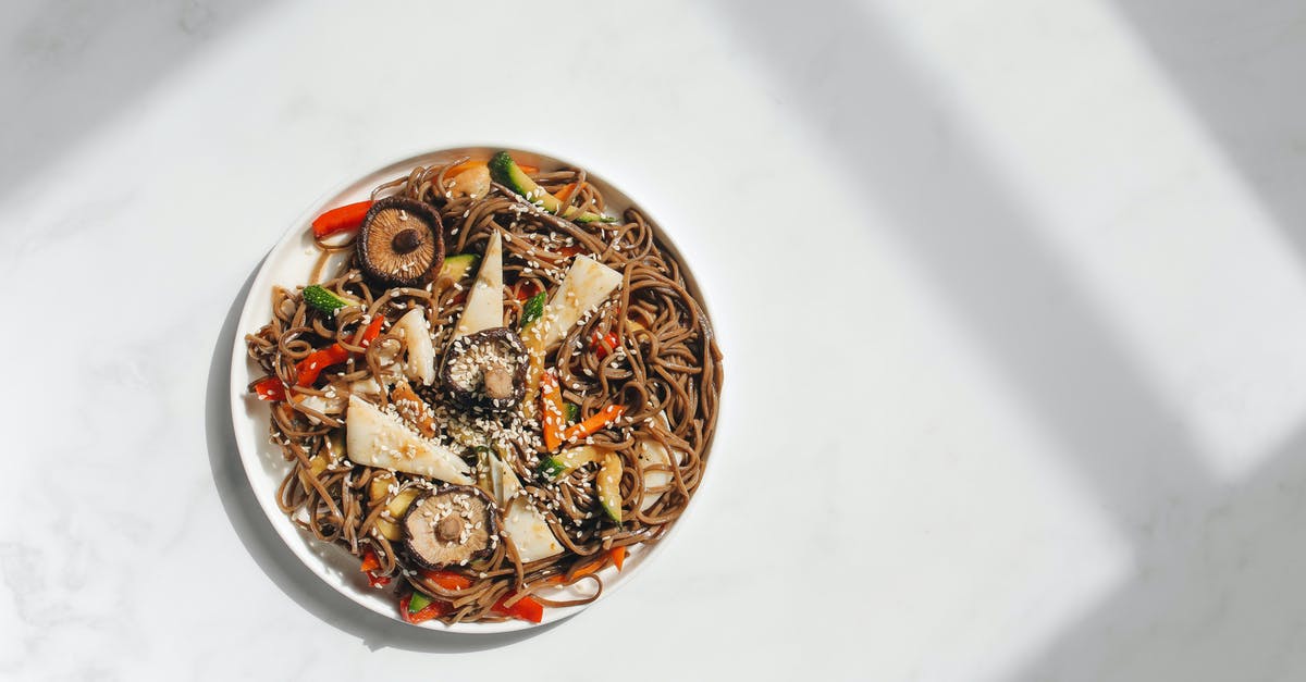 Calories pre-cooked vs cooked - Photo of Noodle Dish on White Ceramic Plate Against White Background