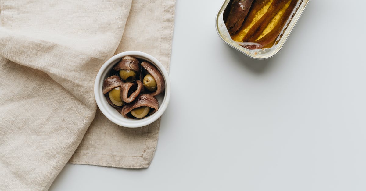 can't find croissant dough; what can I substitute [closed] - Close-Up Shot of a Can of Anchovies beside Olives