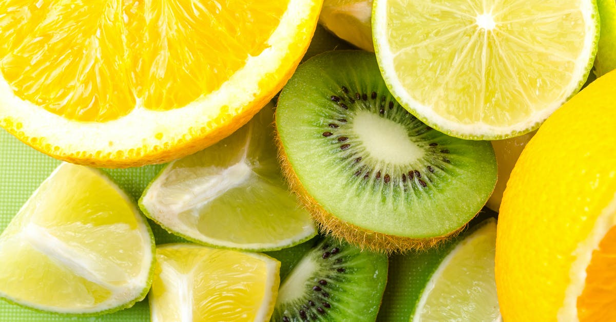 Can a blood orange be half bloody? - Photo of Sliced Kiwi, Lemon, and Orange Fruits