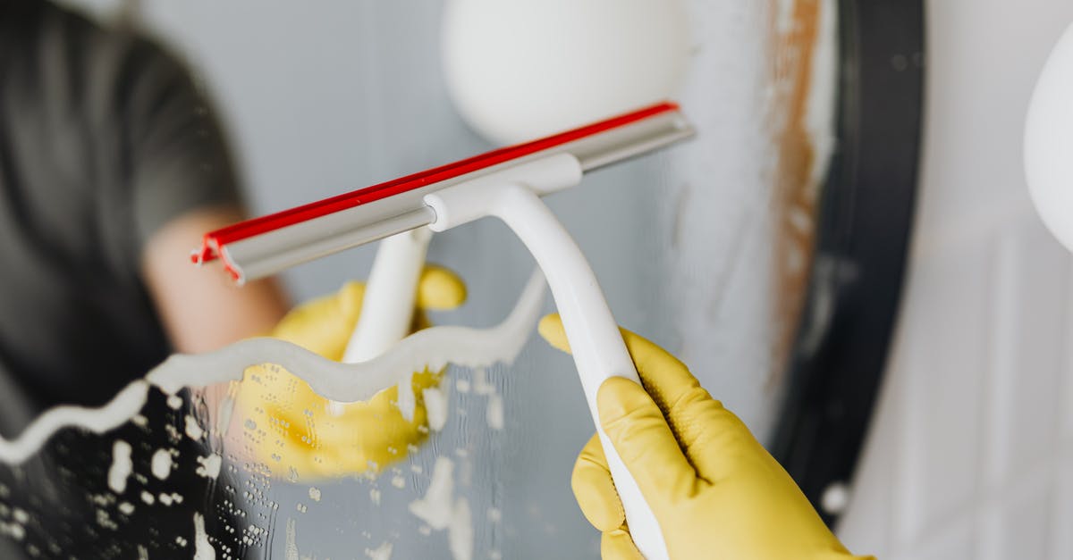 Can a water bath be used to bake brownies? - Anonymous person drying mirror with squeegee