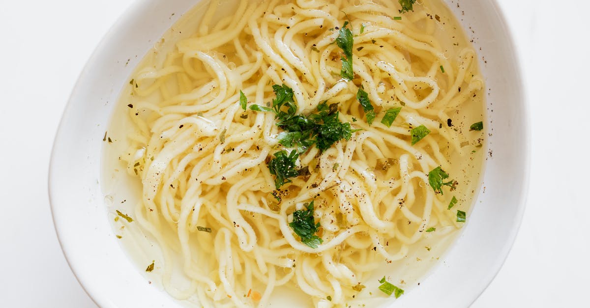 Can boiling a soup too low result in less flavor? - Bowl of noodles sprinkled with greens