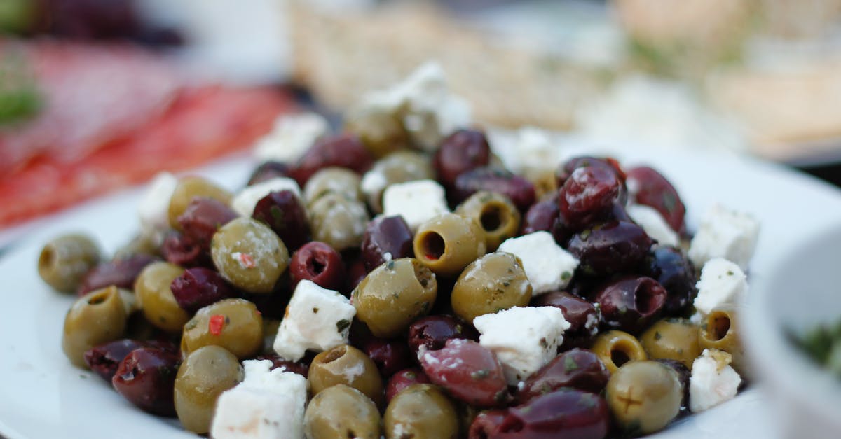 Can crumbled feta cheese last almost a year? - Purple and Green Olives with Cheese on Plate